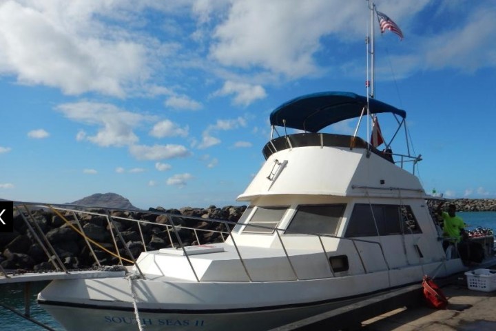 a boat is docked next to a body of water